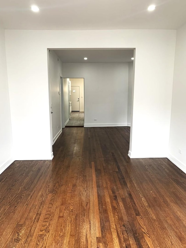 spare room featuring dark hardwood / wood-style floors