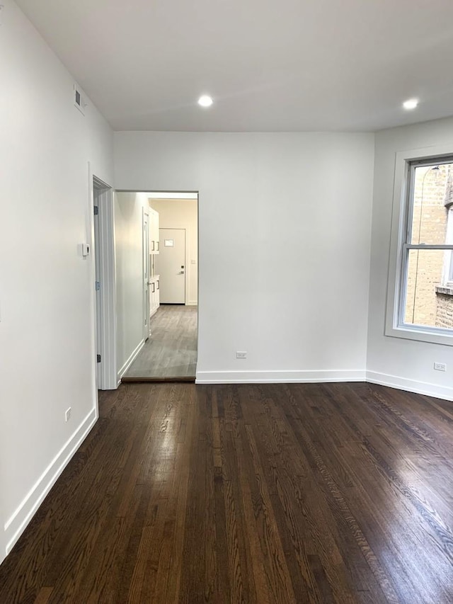 empty room featuring dark hardwood / wood-style floors