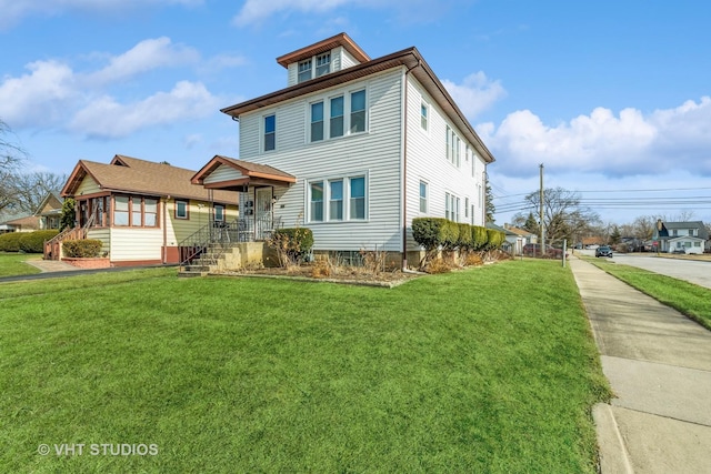 view of front of home with a front lawn