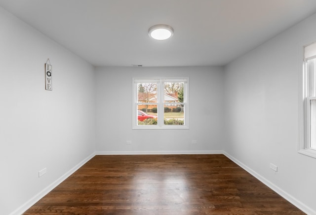 empty room with dark hardwood / wood-style floors