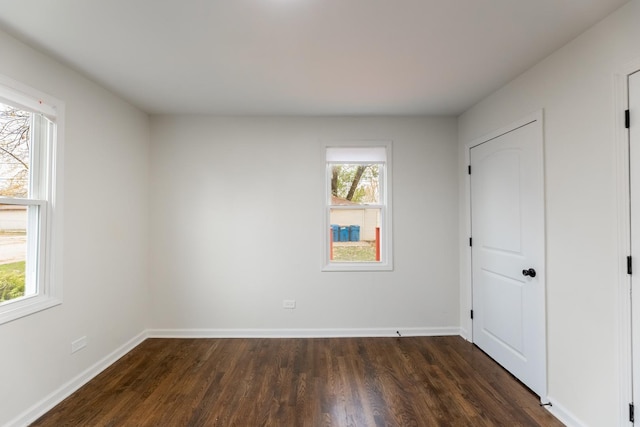 unfurnished bedroom featuring dark hardwood / wood-style floors