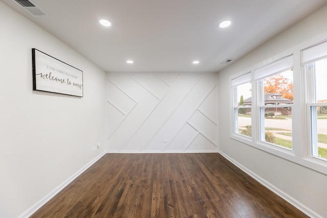 spare room featuring dark hardwood / wood-style flooring