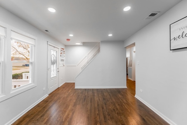 foyer entrance with dark wood-type flooring