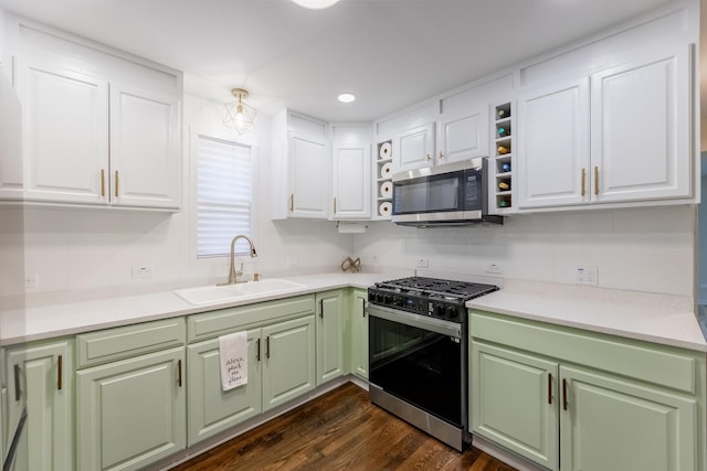 kitchen with white cabinetry, sink, and appliances with stainless steel finishes