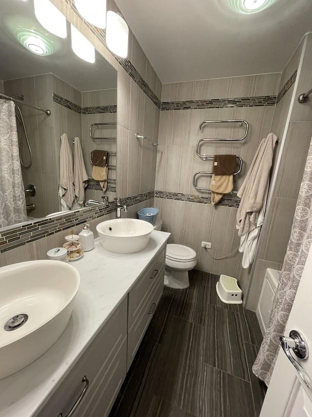 full bathroom with tasteful backsplash, tile walls, vanity, toilet, and shower / bathtub combination with curtain