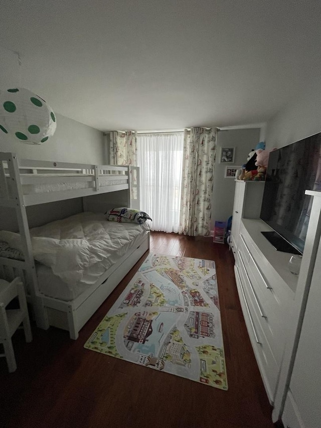 bedroom featuring dark hardwood / wood-style flooring