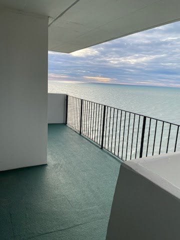 balcony at dusk with a water view