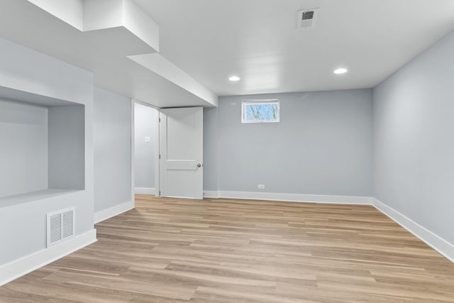 basement featuring light hardwood / wood-style floors