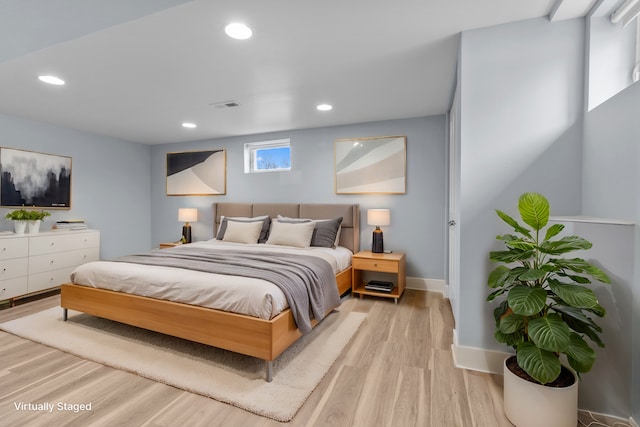 bedroom with light wood-type flooring