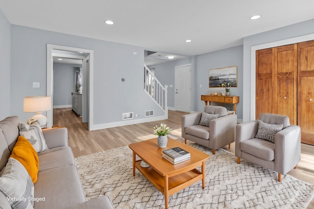 living room with light hardwood / wood-style flooring