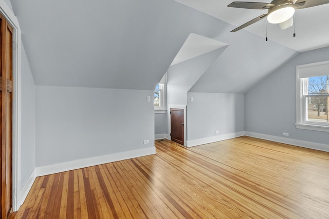 bonus room featuring ceiling fan, lofted ceiling, and light hardwood / wood-style flooring