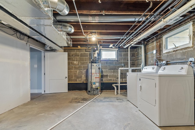 basement with separate washer and dryer and water heater