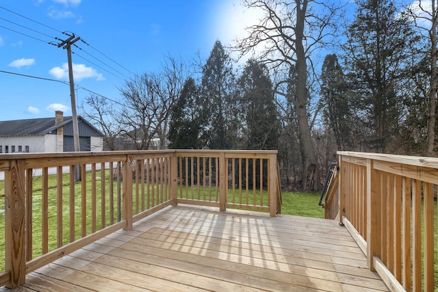 deck featuring a lawn