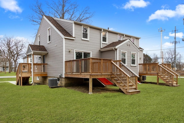 back of property with cooling unit, a wooden deck, and a lawn