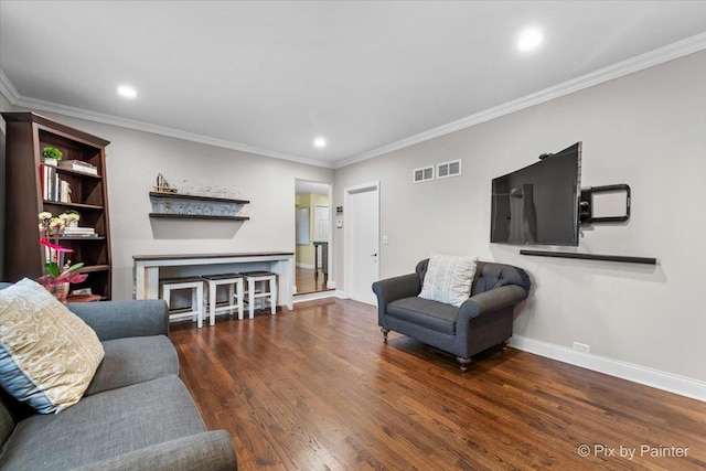 living room featuring ornamental molding and dark hardwood / wood-style flooring