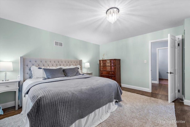 bedroom featuring dark hardwood / wood-style flooring