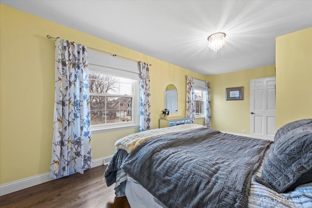 bedroom featuring dark hardwood / wood-style flooring