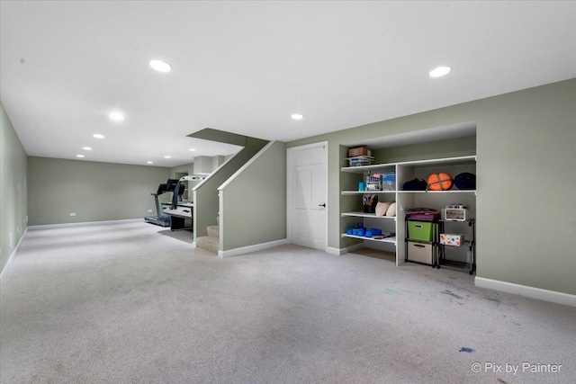 basement featuring light carpet