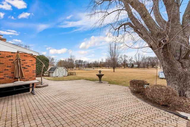 view of patio with a shed