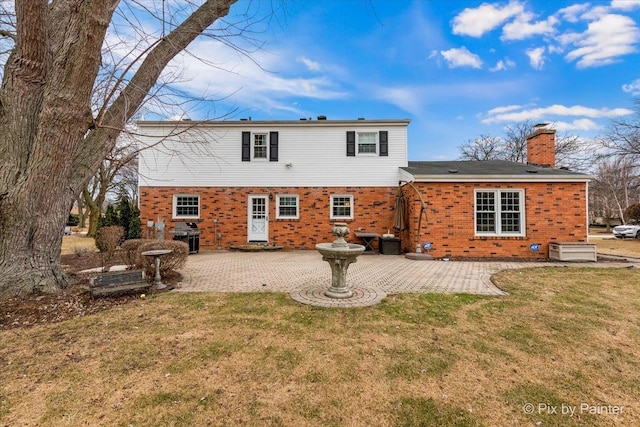 rear view of property with central AC, a patio area, and a lawn