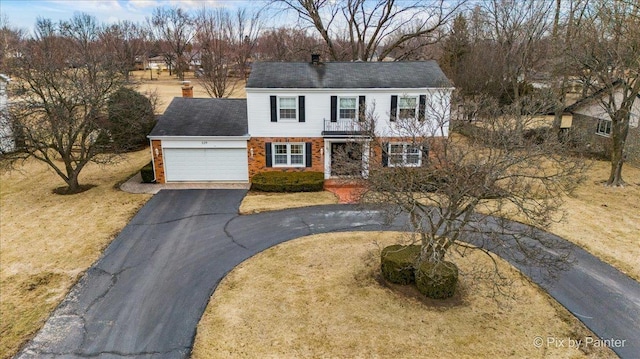 view of front facade featuring a garage and a front lawn