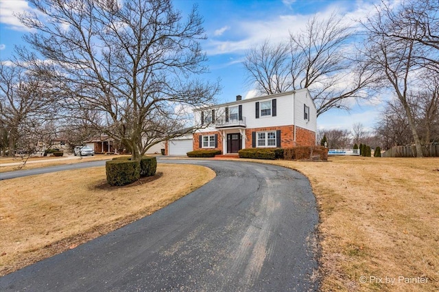 view of front of home with a garage and a front yard