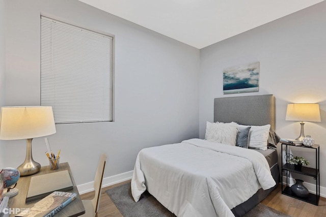 bedroom with hardwood / wood-style floors