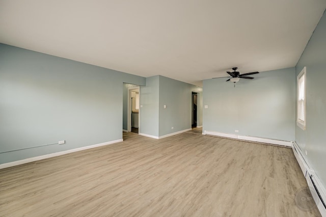 empty room featuring ceiling fan, light wood-type flooring, and a baseboard heating unit