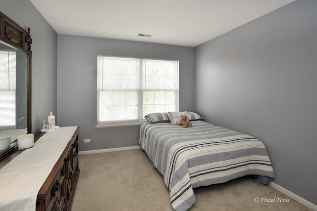 bedroom with light carpet