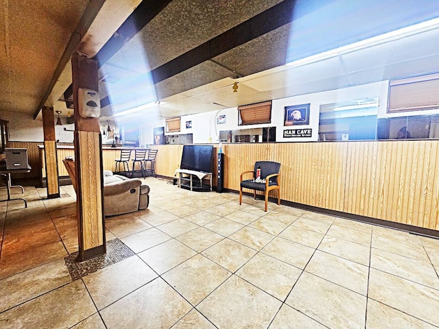 bonus room with light tile patterned flooring