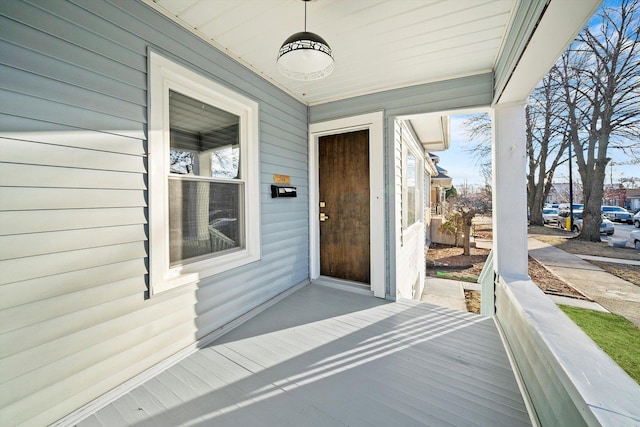 doorway to property with covered porch