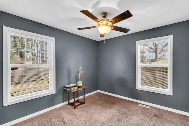 carpeted empty room with ceiling fan