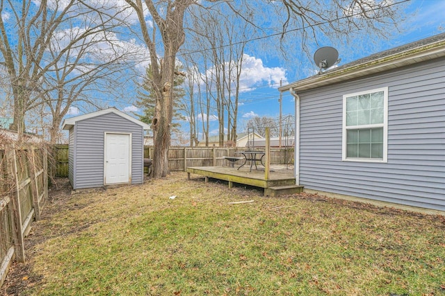 view of yard featuring a shed and a wooden deck