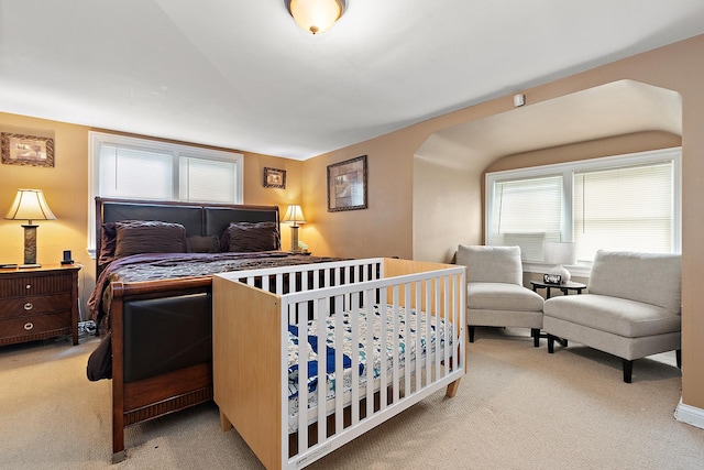 bedroom with light colored carpet