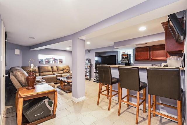 living room featuring indoor bar