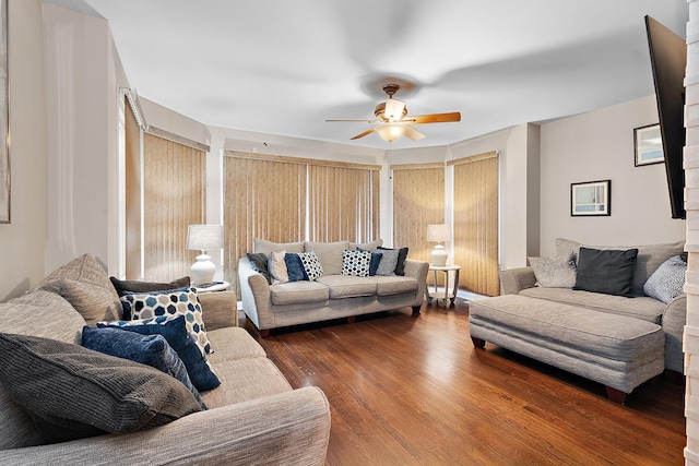 living room with dark hardwood / wood-style floors and ceiling fan