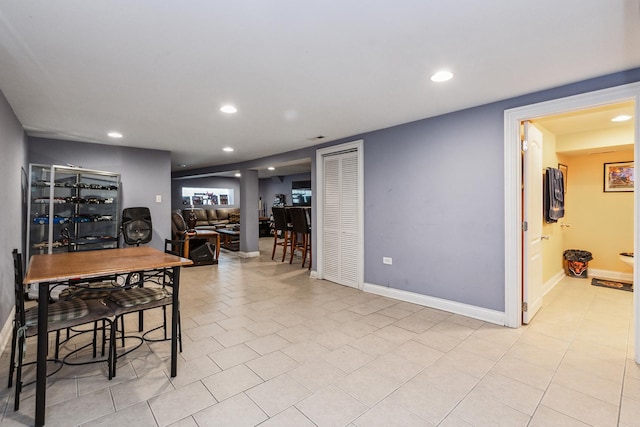 dining area with light tile patterned floors