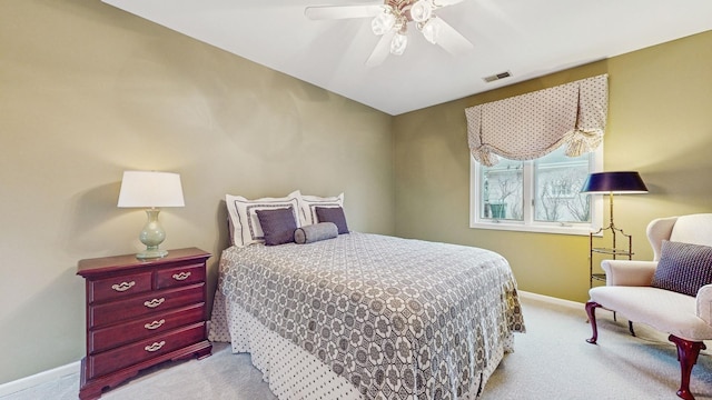 bedroom featuring light colored carpet and ceiling fan