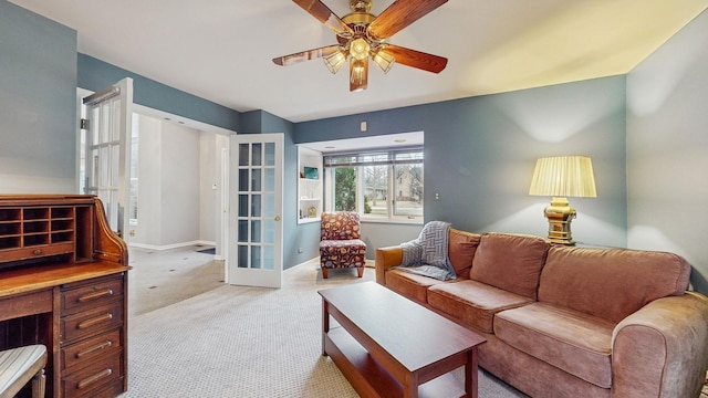 living room with light carpet, ceiling fan, and french doors