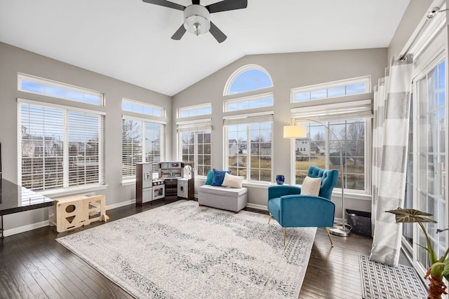 sunroom featuring vaulted ceiling and ceiling fan