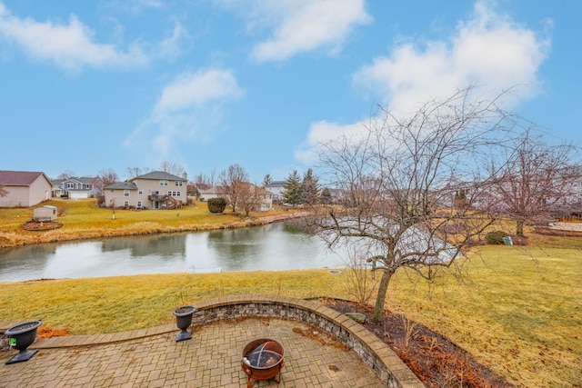 property view of water with an outdoor fire pit and a residential view