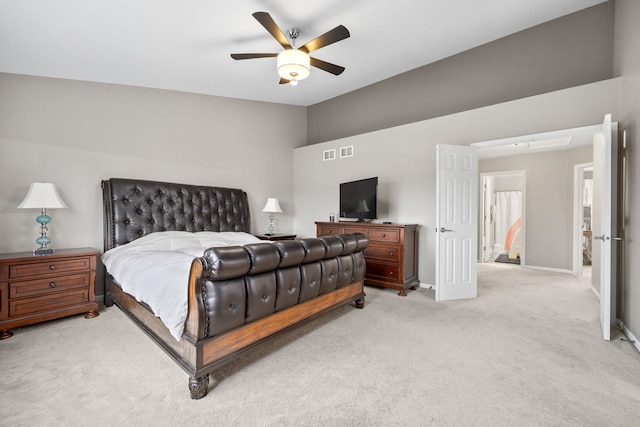 bedroom featuring lofted ceiling, visible vents, attic access, light carpet, and baseboards