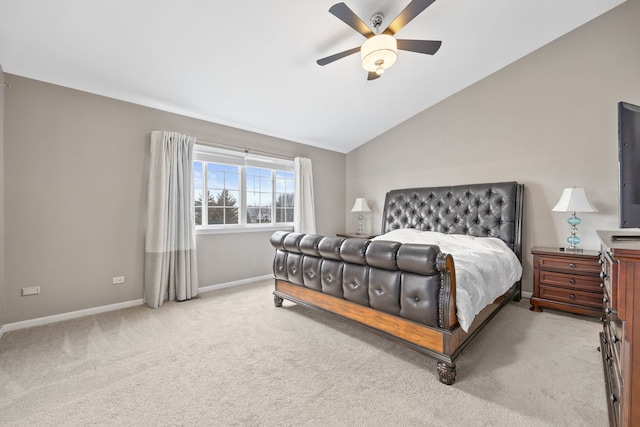 bedroom with vaulted ceiling, ceiling fan, carpet flooring, and baseboards