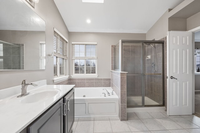 bathroom featuring a whirlpool tub, a shower stall, vanity, and tile patterned floors