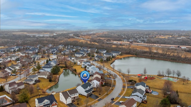 bird's eye view with a water view and a residential view