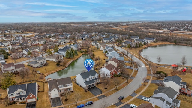 aerial view featuring a water view and a residential view