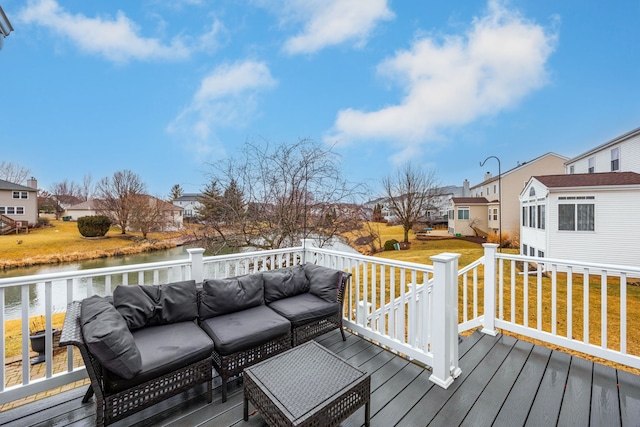 deck with a water view, a residential view, an outdoor hangout area, and a lawn