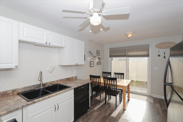 kitchen featuring sink, white cabinetry, dark hardwood / wood-style floors, black appliances, and decorative backsplash