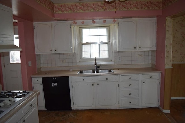 kitchen with sink, white gas stovetop, dishwasher, decorative backsplash, and white cabinets