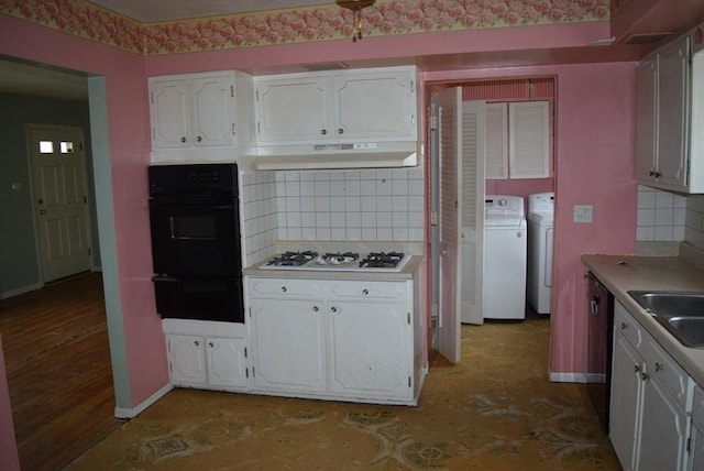 kitchen with tasteful backsplash, white gas stovetop, washer and dryer, white cabinets, and oven